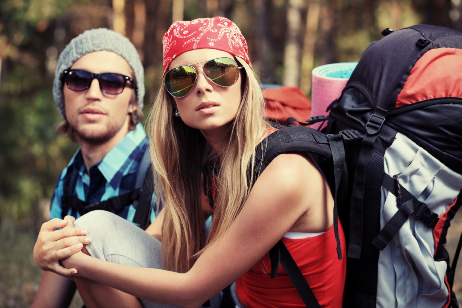 Couple of tourists making their journey at the mountains.