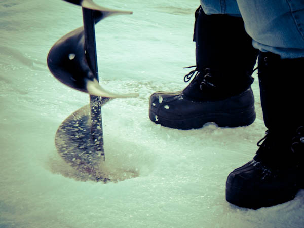Drilling in ice with Auger - Ice Fishing